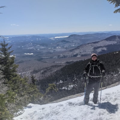 Mike standing on a cliff on Mt. Whiteface.