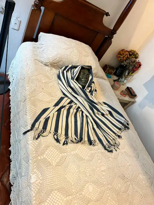 Frida Kahlo's death mask resting on her bed in her home La Casa Azul in Mexico City