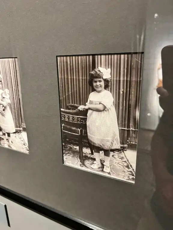 A photo in the Museum of Frida Kahlo as a child wearing a tehuana dress